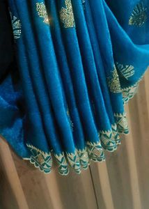 Elegant Teal Saree with Gold Embellishments