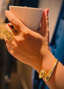 Elegant Gold Feather Ring &amp; Bangle Set
