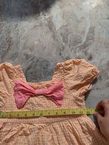 Cute Peach Dress with Pink Bow