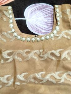 It's Beige color Gown.  I