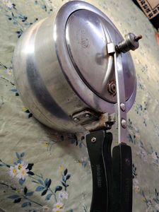 A silver pressure cooker