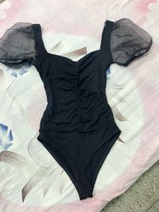 Chic Black Bodysuit with Sheer Puff Sleeves