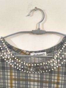 Chic Plaid Tunic with Embellished Neckline