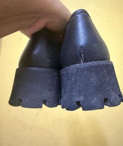 Chic Black Loafers with Gold Accent