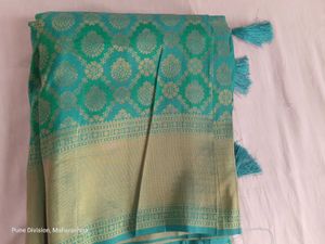 Beautiful semi kanjivaram Teal Saree with Gold Bro