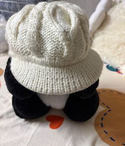 creamy-white knit,  textured cable pattern