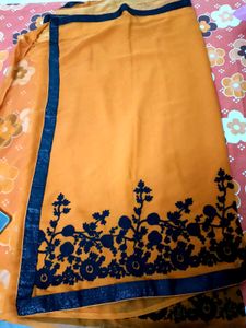 Vibrant Orange Saree with Floral Border
