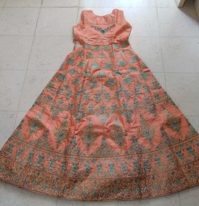 Ethnic peach gown with rich embroidery