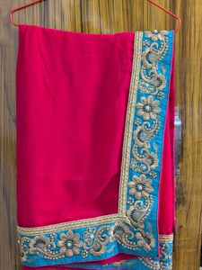 Elegant Red Saree with Green  Embroidery
