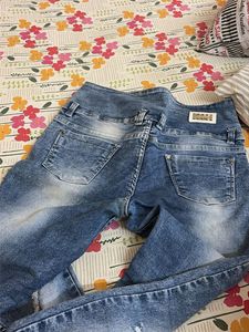 Distressed Blue Denim Jeans