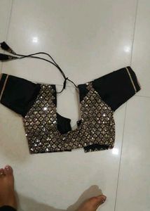 Elegant Black Saree with Golden Embellishments