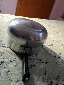 A silver pressure cooker