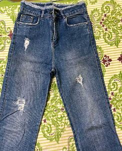 Distressed Blue Denim Jeans