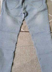 Light Wash Moto Jeans with Perforated Accents