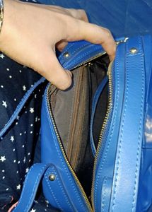 Vibrant Blue Handbag with Embellished Clasp