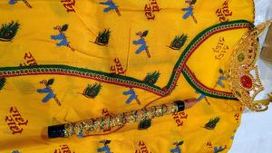 Beautiful Yellow Ethnic Dress with Crown and Flute