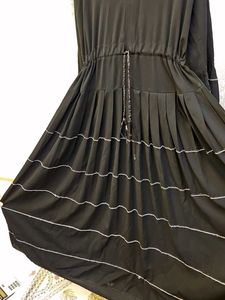 elegant black umbrella abaya with white tiers