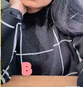 Black and white grid sweater