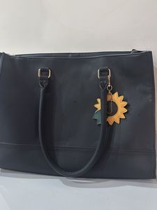 Chic Black Tote Bag with Sunflower Charm
