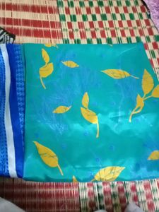 Vibrant Teal Saree with Yellow Leaf Print