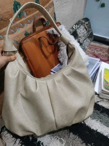 Beige hand beg