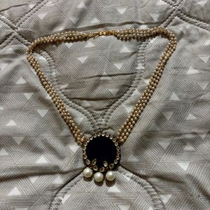 Elegant Pearl Necklace with Dark Pendant