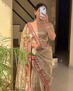 Elegant Golden Saree with Red Border