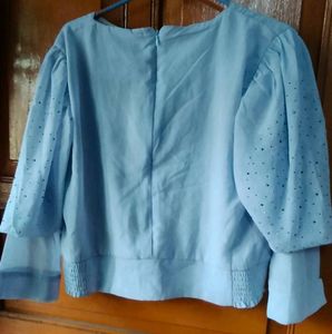 Elegant Light Blue Top with Embellished Sleeve