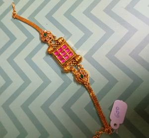 Gold Tone Bajuband with Red and Green Stones