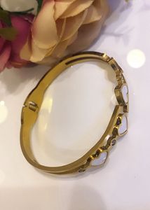 new anti tarnish Gold Heart Charm Bangle