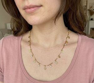 Elegant Gold Necklace with Charms
