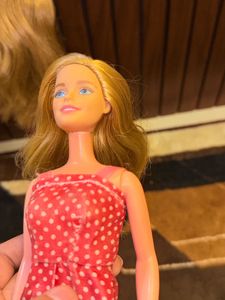 Two barbie dolls