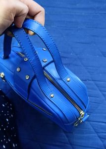 Vibrant Blue Handbag with Embellished Clasp