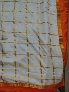 Cream saree with orange blouse