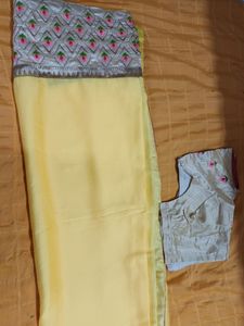 Synthetic yellow saree with stitched blouse