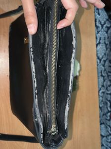 Chic Black Handbag with Pom-Pom Charm