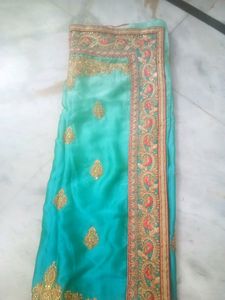 Elegant Teal Saree with Gold Embroidery