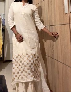 Elegant Cream Kurta with Embellished Neckline