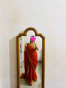 Vibrant Orange Saree with Golden Border