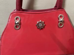Red Handbag with Embellishments