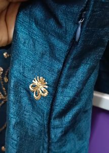 Its a Blue Dress.. With Beads Work On It.