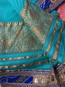 Stunning Teal Saree with Gold Border
