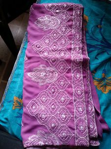 Georgette saree eith blouse..border and design...Pink in colour..