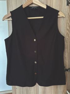 black waistcoat with brass buttons
