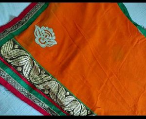 Vibrant Orange Saree with Golden Border