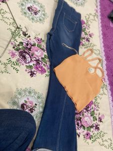 Blue Flared Jeans with Orange Crop Top