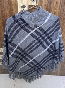 Beautiful Knit Poncho With Pattern Detailing