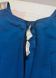 Stylish Teal Jumpsuit with Gold Embellishment