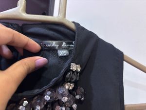 Chic Black Dress with Embellished Neckline