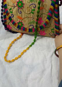 Embroidered Clutch Bag with Beaded Strap